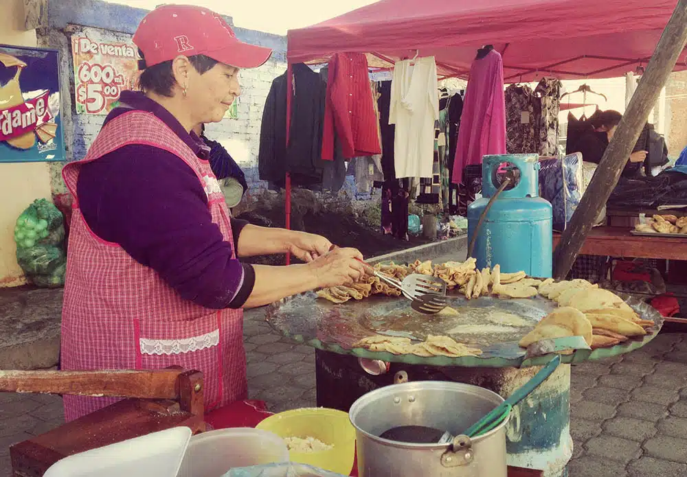 Lady making breakfast tacos